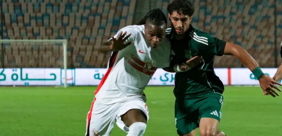 Two players contesting the ball during a match