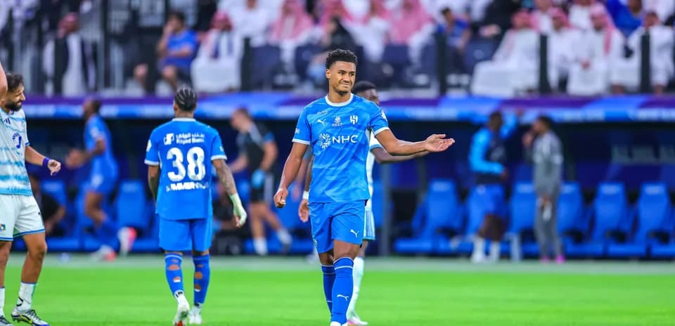 Player in blue jersey gesturing during match
