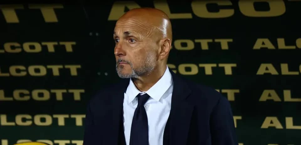 Coach standing on the sidelines during match