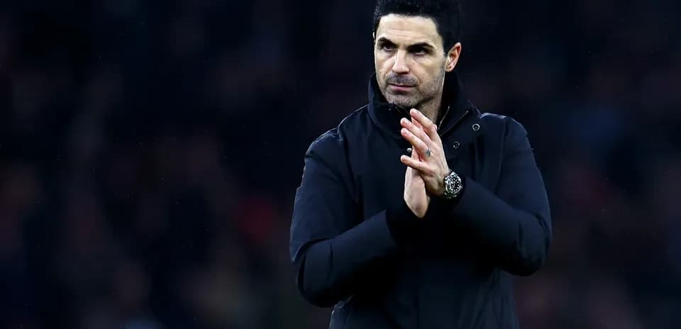 Manager applauding fans after the match