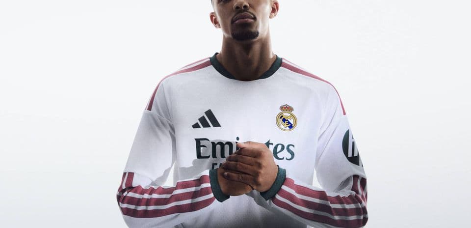 Player posing in Real Madrid home jersey