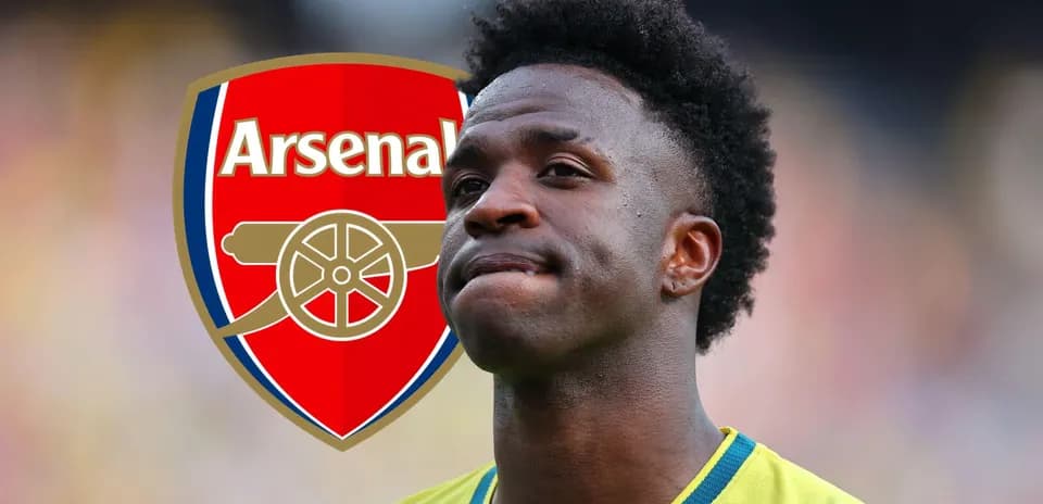 Player standing with Arsenal logo in background
