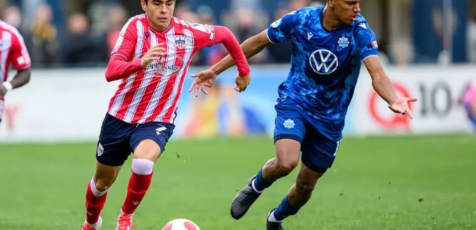 Players competing for the ball during match