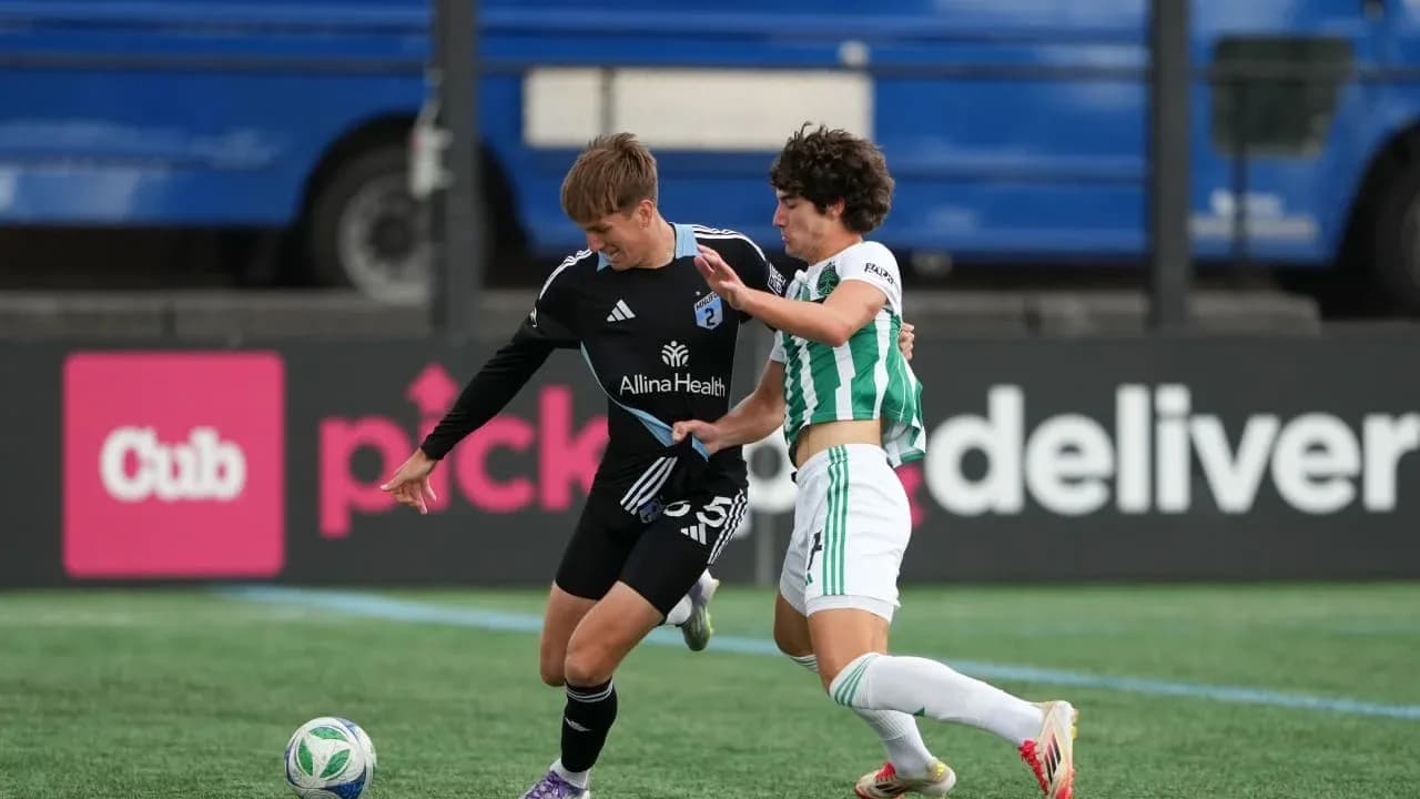Players competing for the ball in match