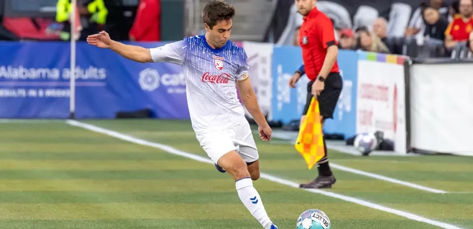 Player taking a corner kick during match