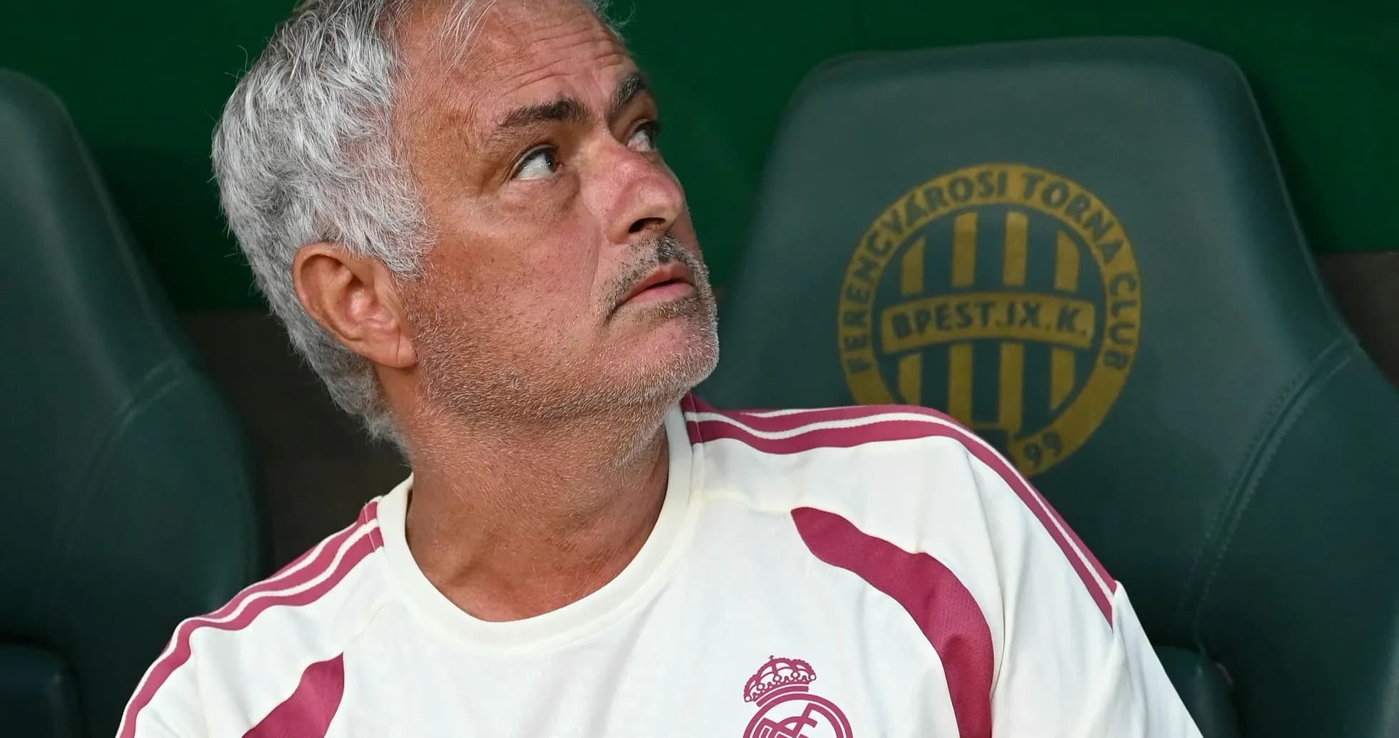 Coach sitting on bench during match observation