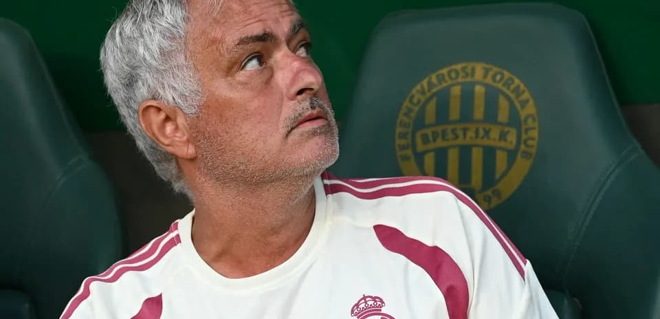 Coach sitting on bench during match observation