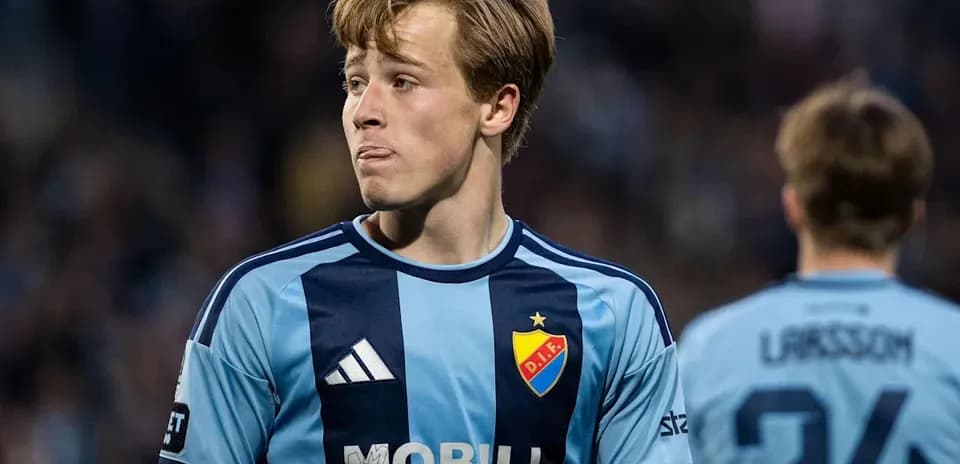 Player in blue jersey during football match