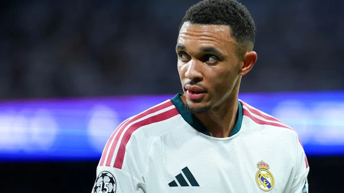 Football player wearing Real Madrid jersey on field