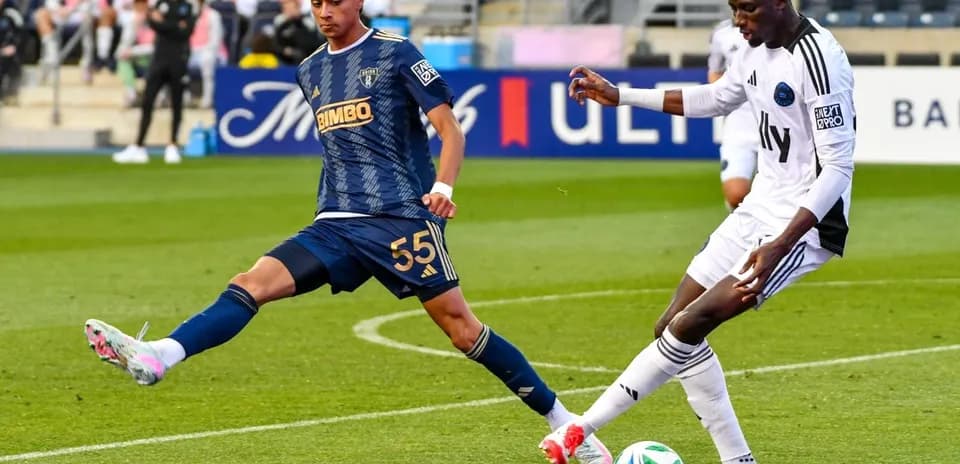 Crown Legacy player tackling Philadelphia Union II player