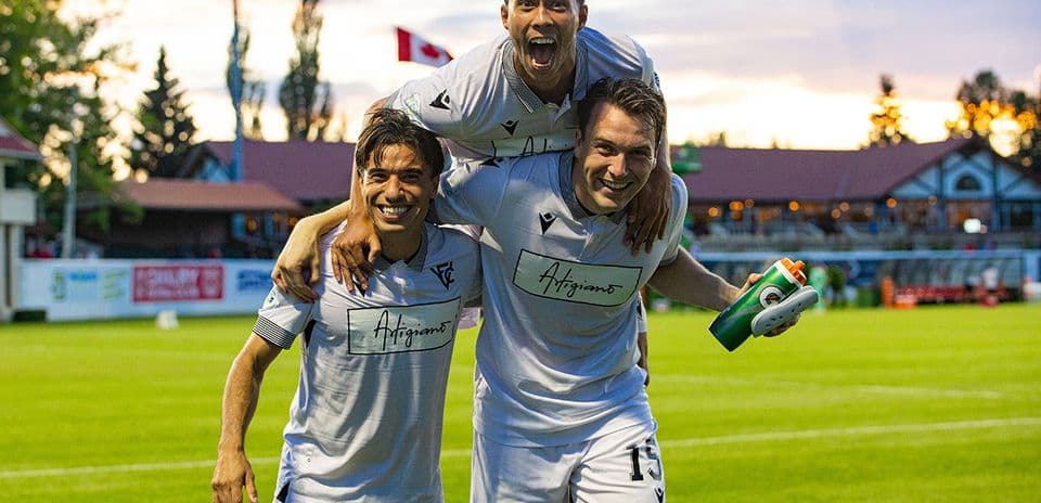 Vancouver FC players celebrating on the pitch