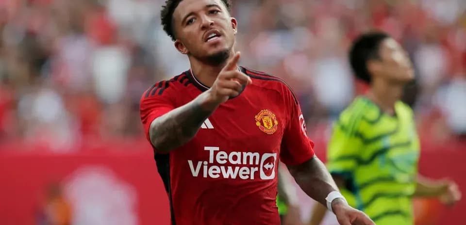 Player celebrating a goal in Manchester United jersey