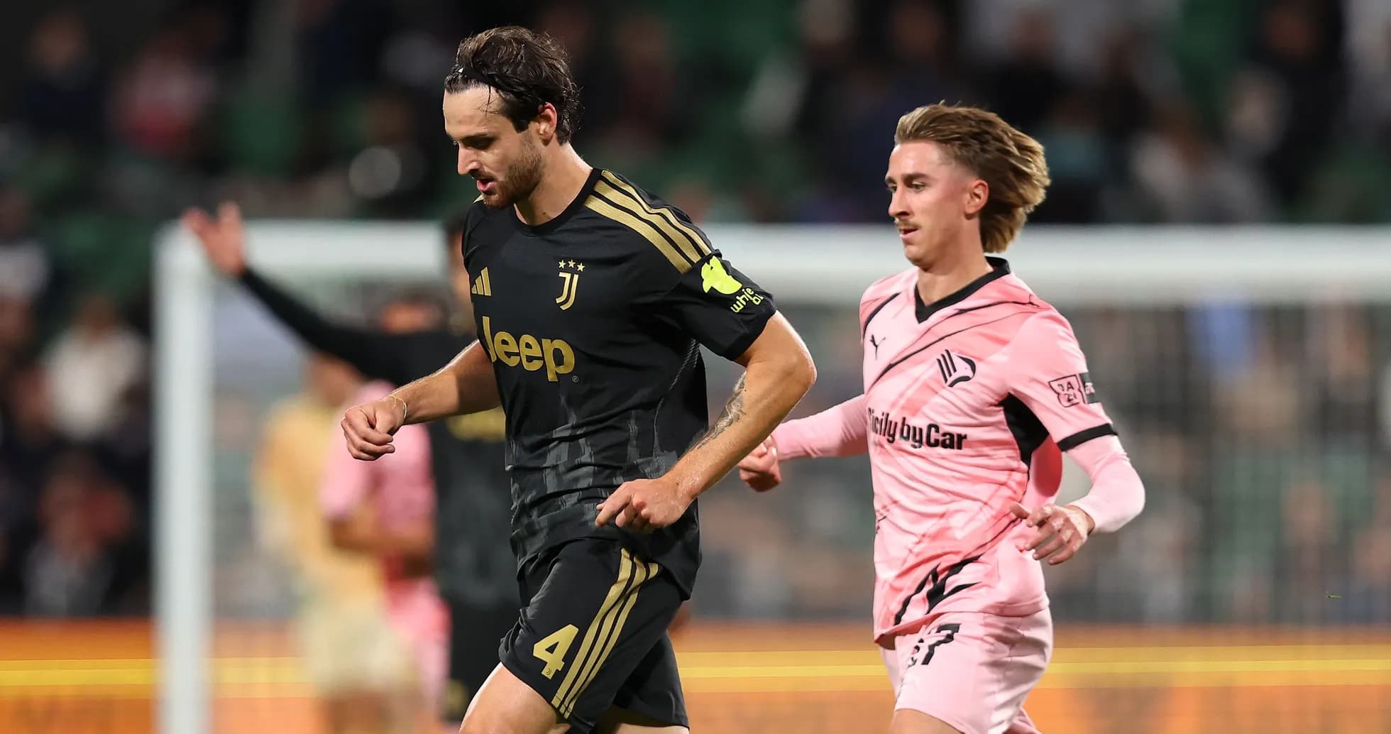 Juventus player being pursued by opponent on field