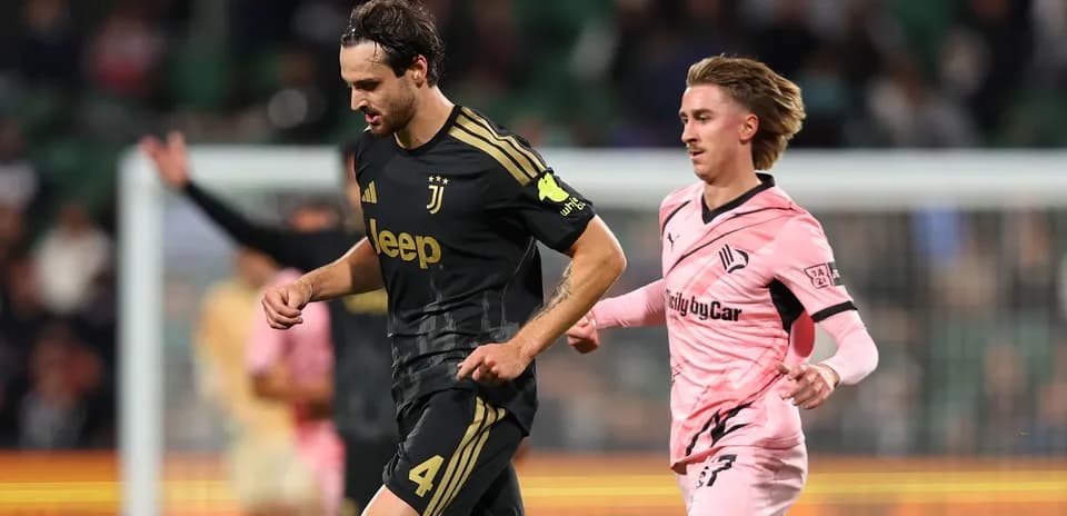 Juventus player being pursued by opponent on field