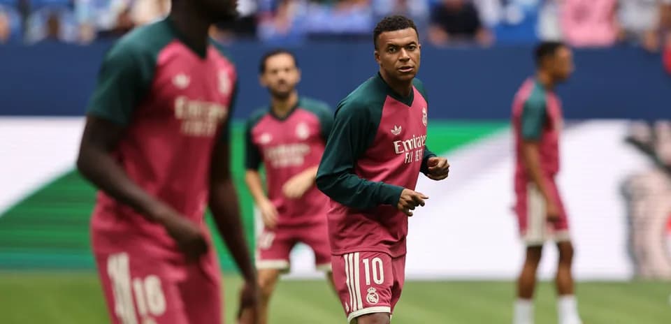 Players warming up on the pitch before match