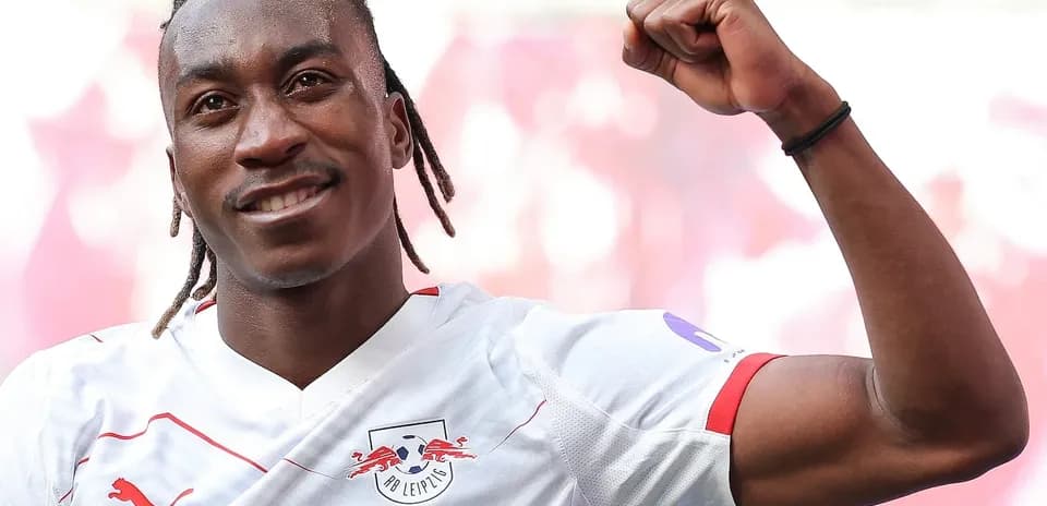 Player celebrating victory in RB Leipzig jersey