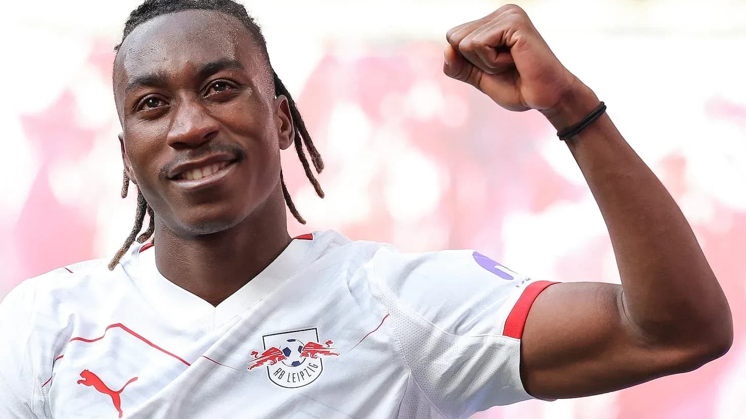Player celebrating victory in RB Leipzig jersey