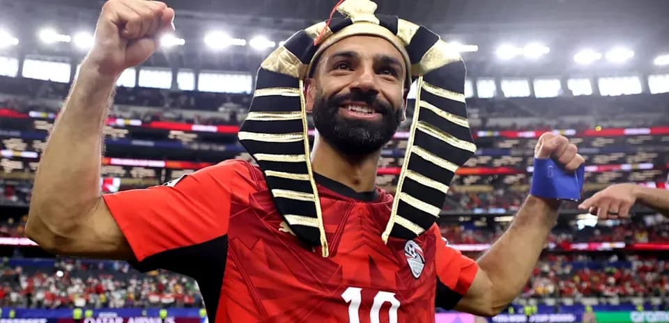 Player celebrating with pharaoh headdress after match
