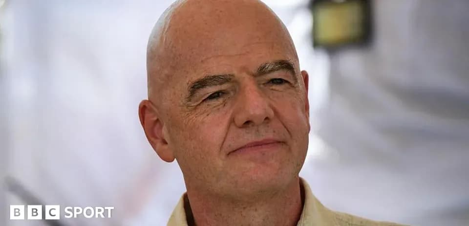 Man with bald head and neutral expression