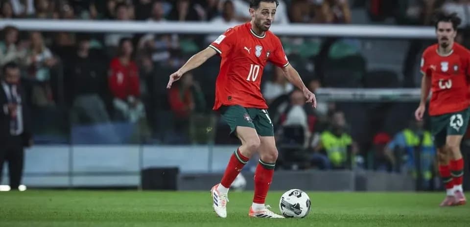 Player in red jersey controlling ball during match