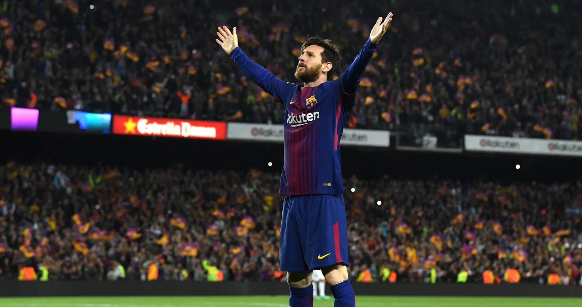 Player celebrating with arms raised at stadium