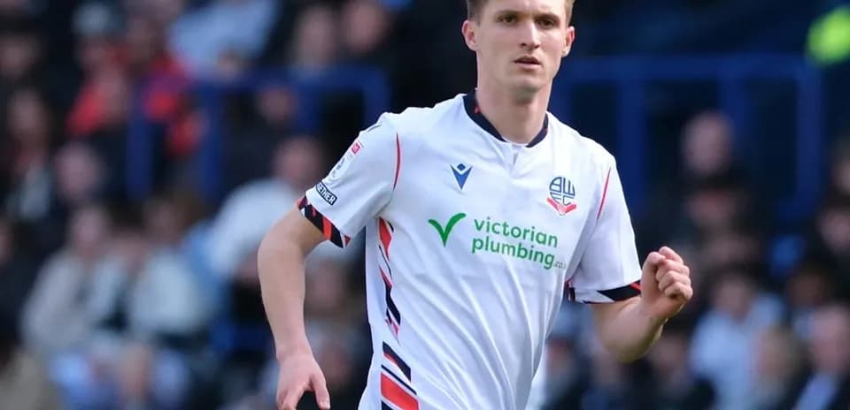 Bolton Wanderers player running during match