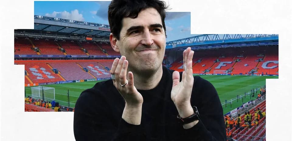 Man applauding in front of Anfield stadium