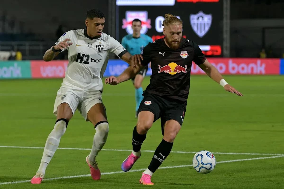 Two players contesting for the ball during match