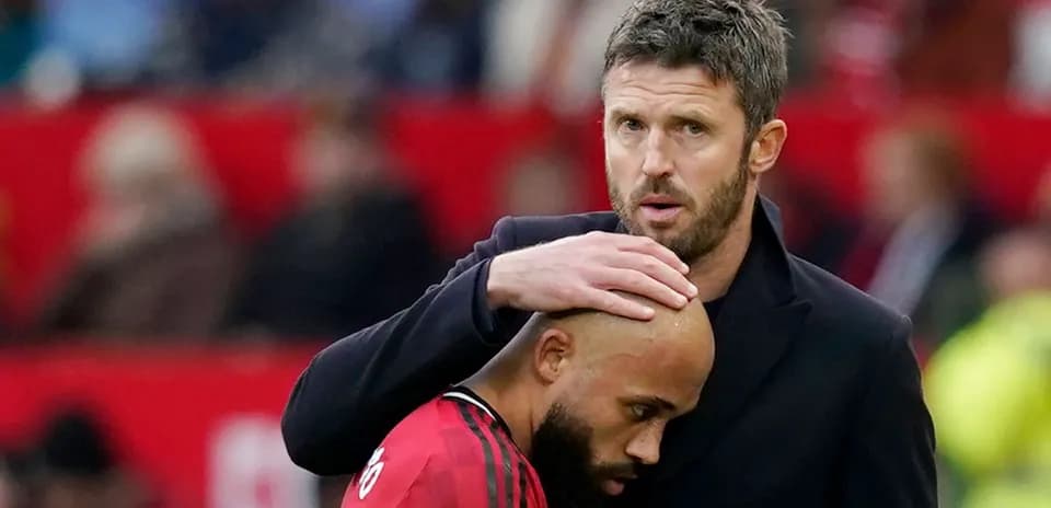Coach comforting player on the sidelines during match