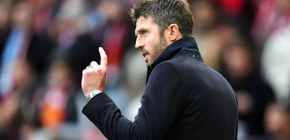 Manager gesturing during match on the sidelines