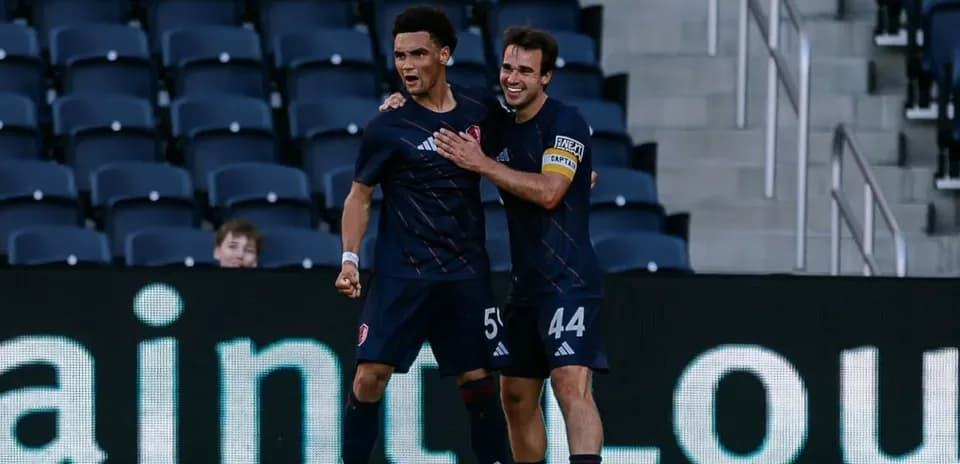 Players celebrating a goal during match
