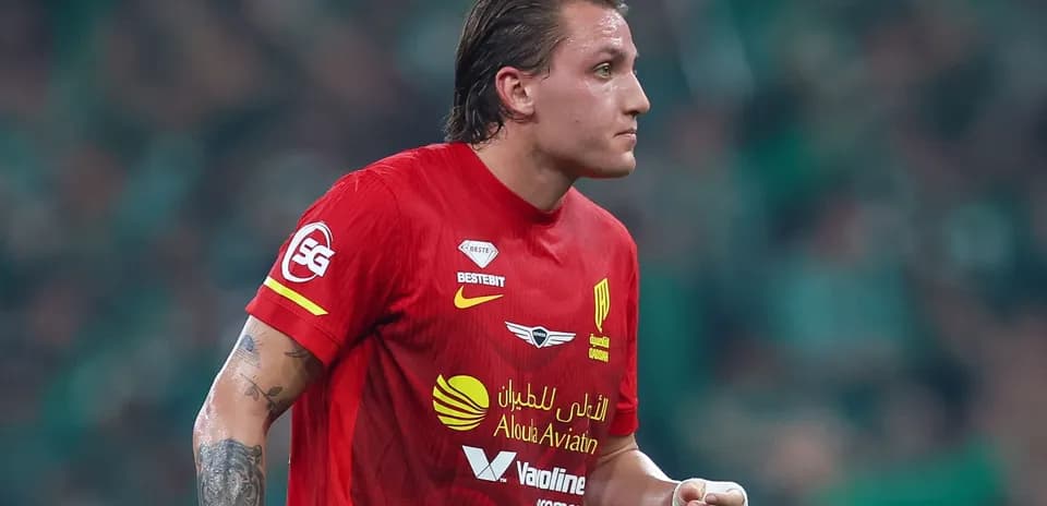 Player in red jersey running on the field