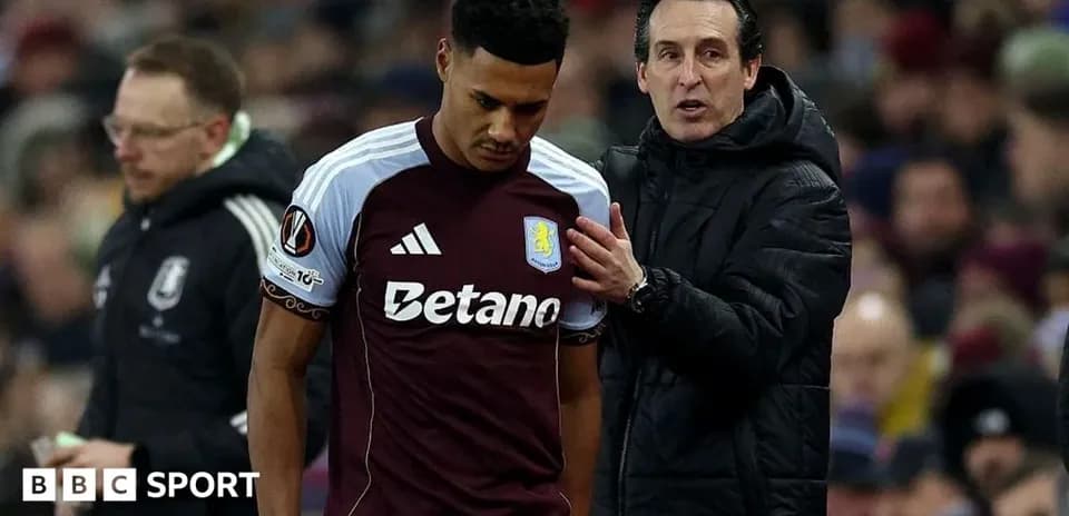 Aston Villa player being spoken to by coach