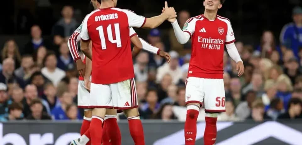 Arsenal players celebrating on the pitch