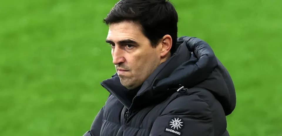 Coach observing the match from the sidelines