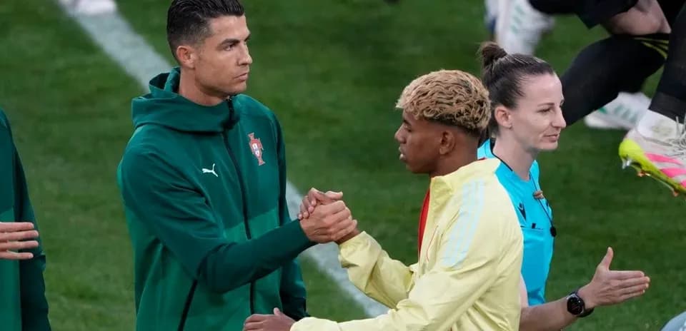 Cristiano Ronaldo shaking hands with teammate before match