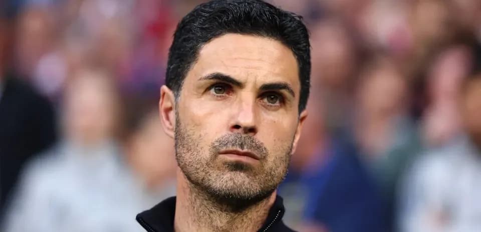 Coach observing match with focused expression