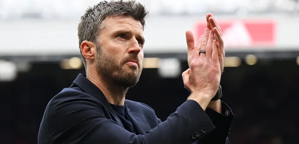 Coach applauding fans at the stadium