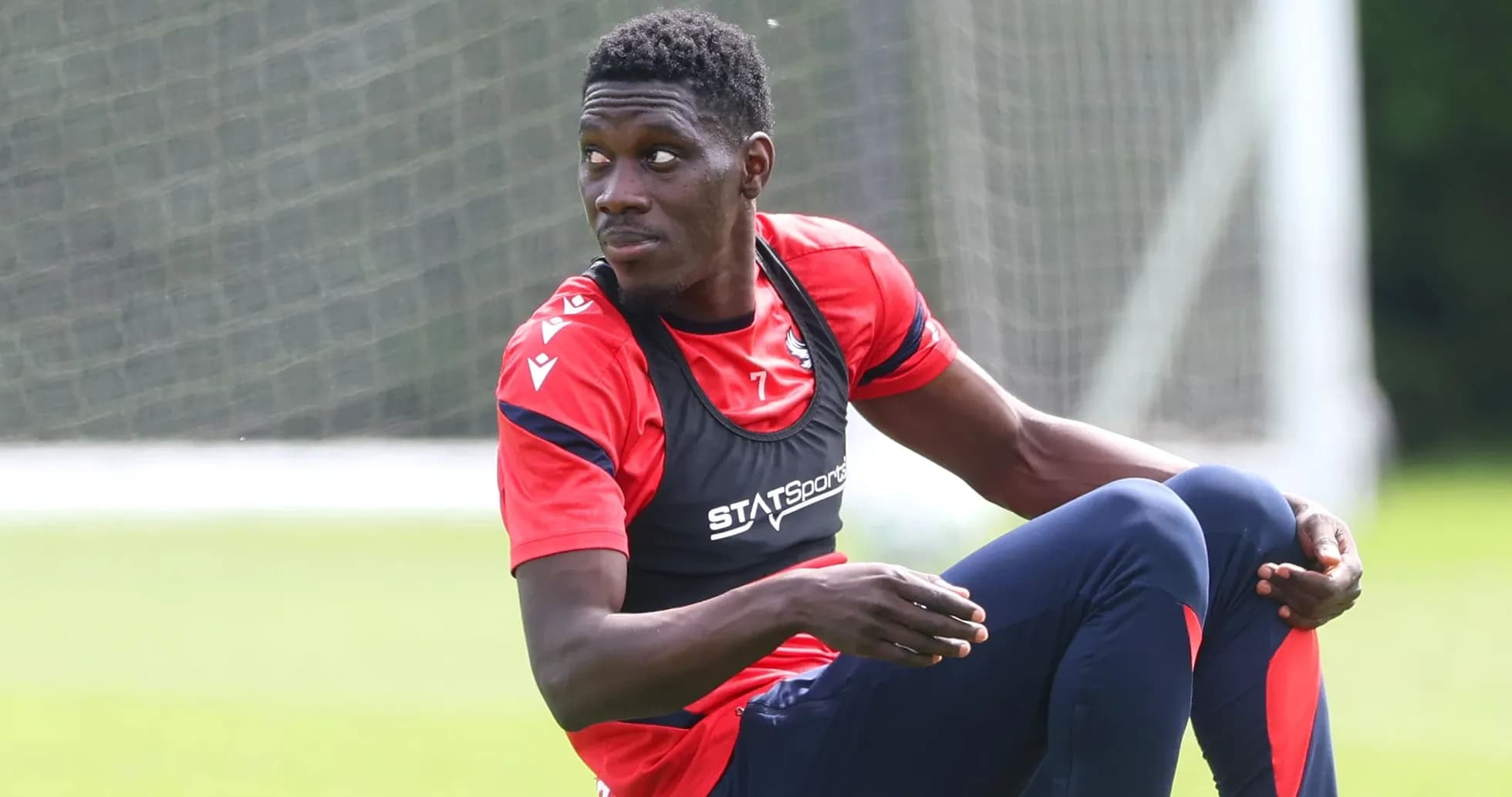 Player sitting on training pitch during session