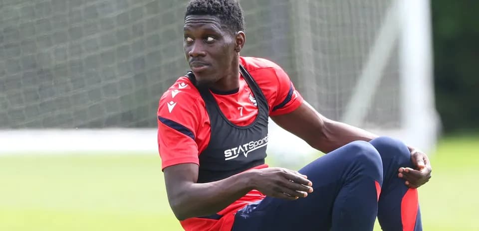 Player sitting on training pitch during session