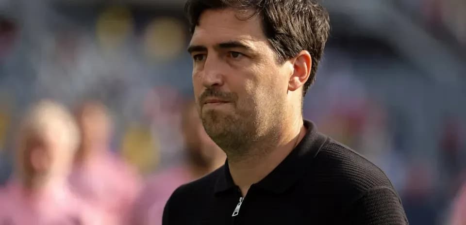 Coach observing the match before kickoff