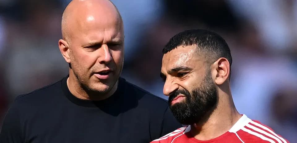 Two men discussing on the football pitch