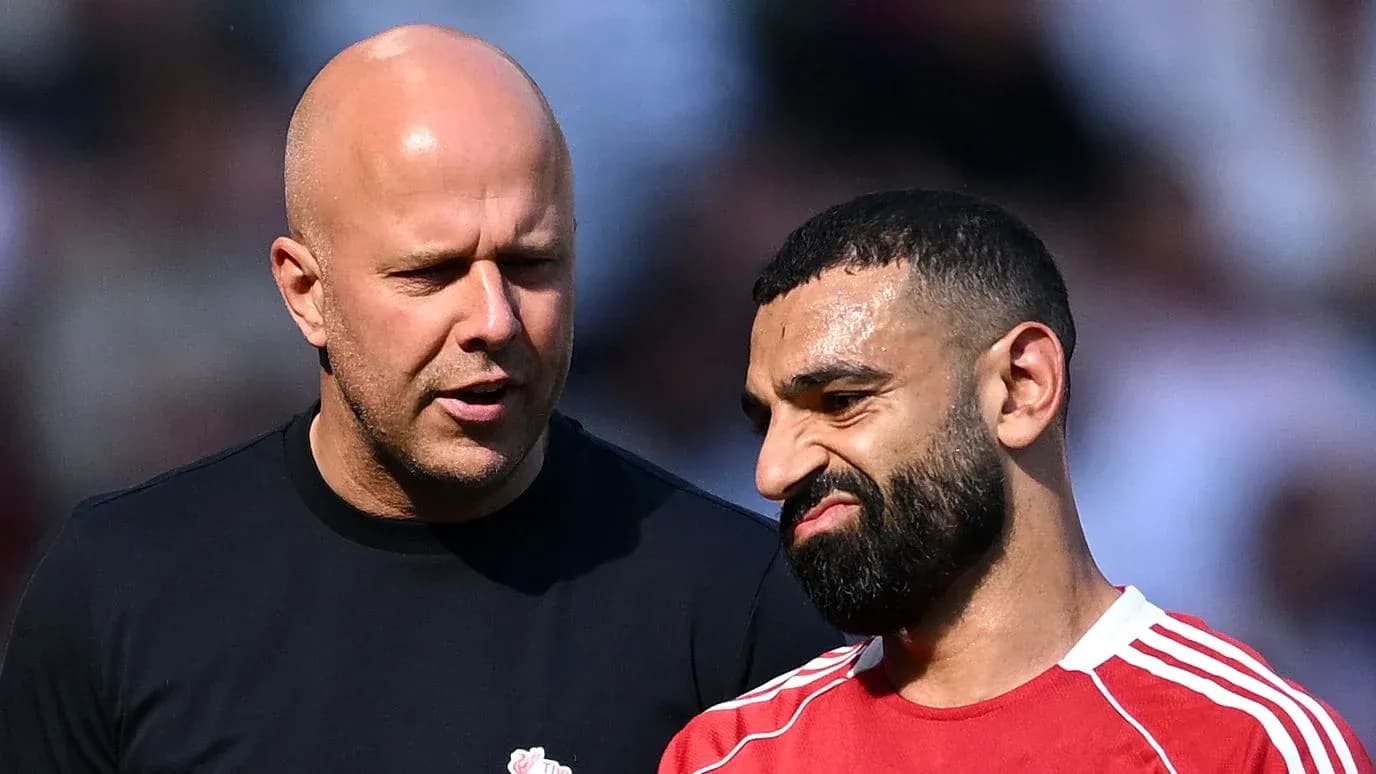 Two men discussing on the football pitch
