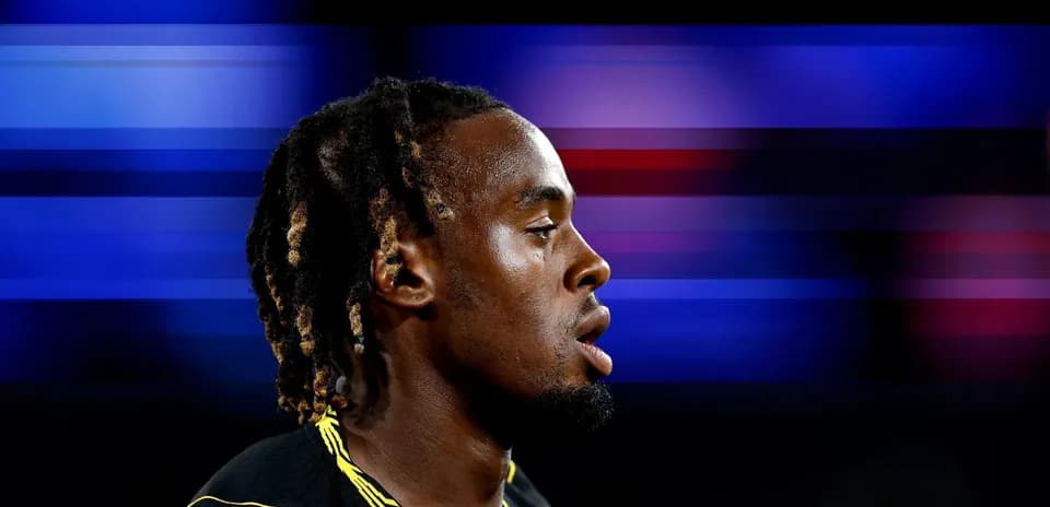 Athlete in profile with blurred background colors