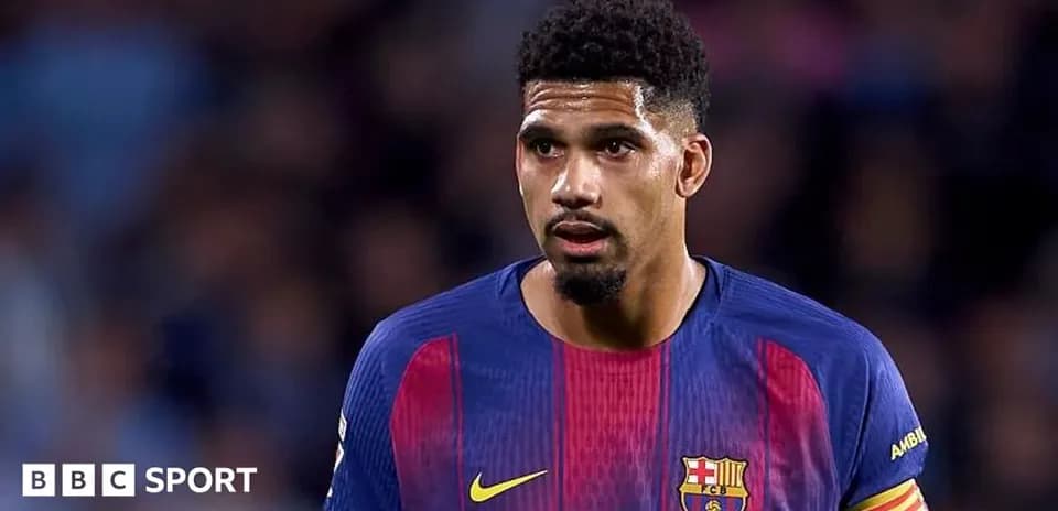 Football player wearing Barcelona jersey on field
