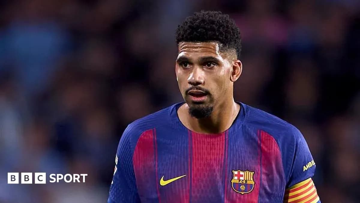 Football player wearing Barcelona jersey on field