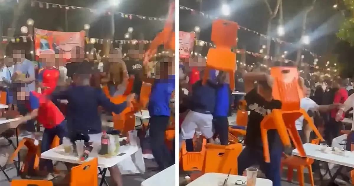 Crowd throwing chairs during a chaotic celebration