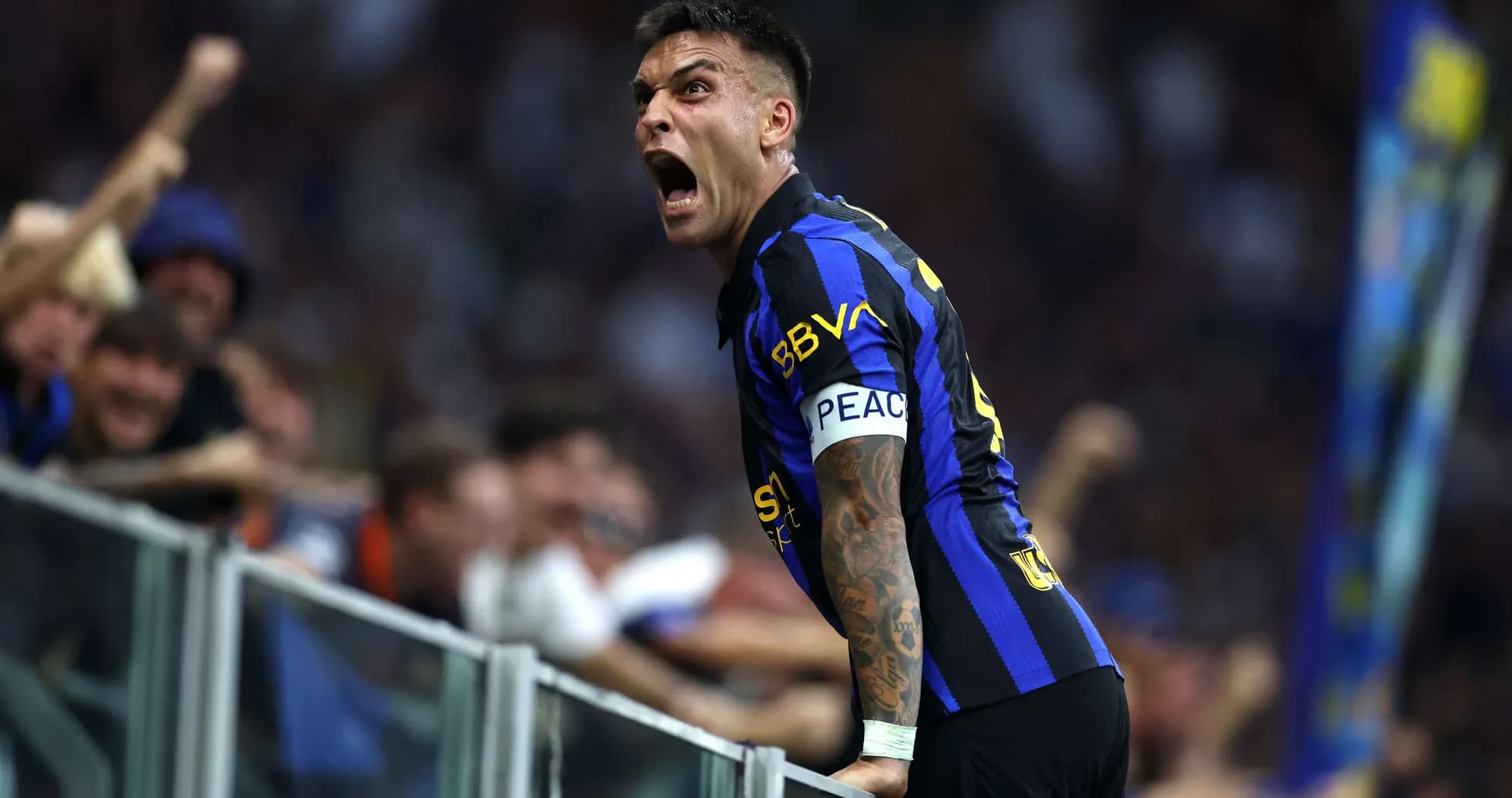 Lautaro Martínez celebrating with fans after a goal
