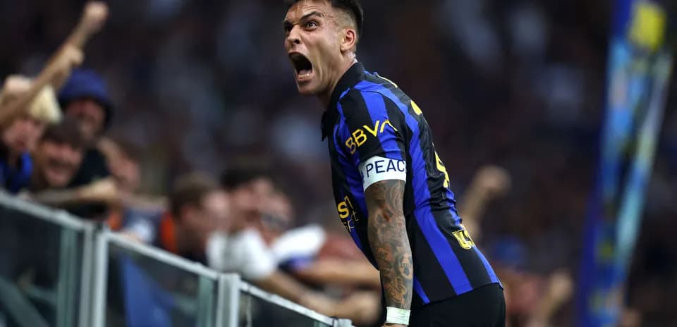 Lautaro Martínez celebrating with fans after a goal