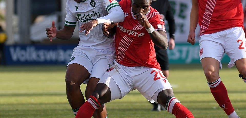 Players competing for the ball during match